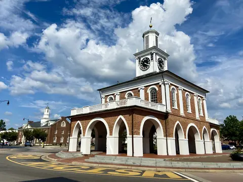 The Market House in downtown Fayetteville under a summer sky